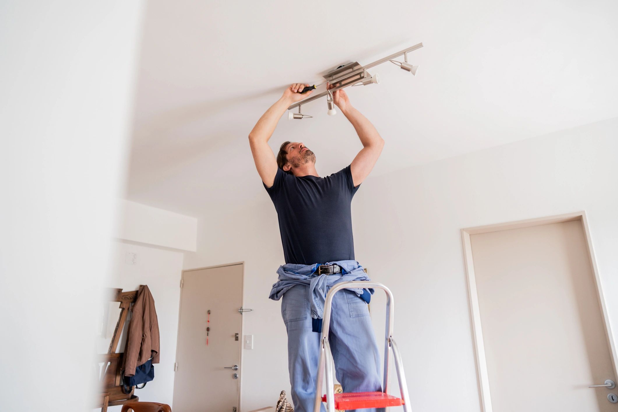 Professional performing home maintenance indoors